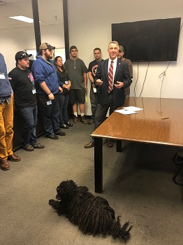 Governor Phil Scott speaks to workers at Super Thin Saws